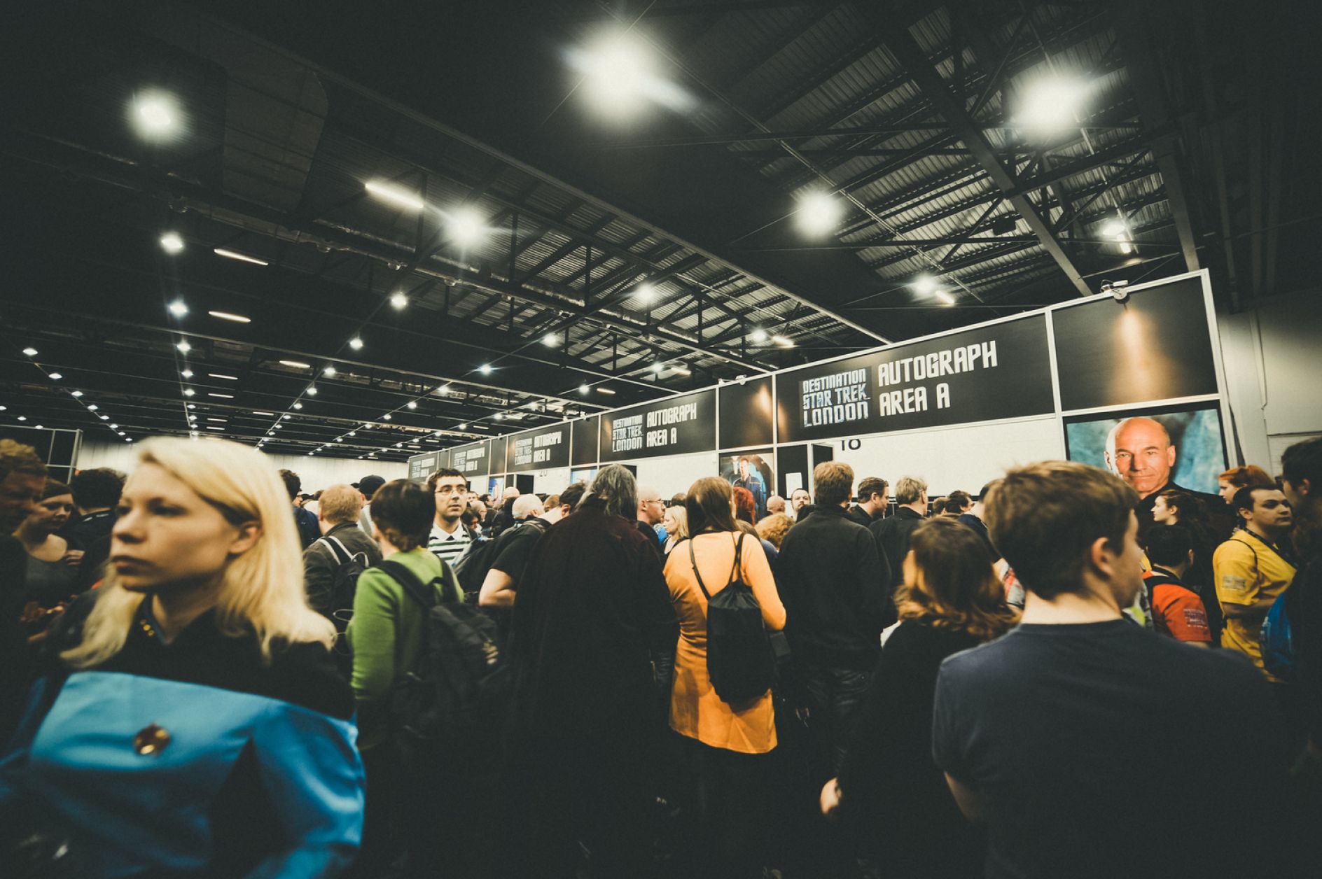 Crowded sci-fi convention hall